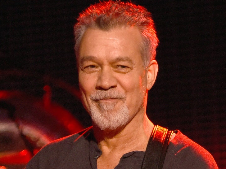 an older Eddie van halen smiling