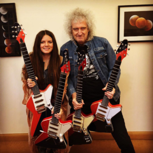 arielle and brian may with the arielle signature guitar