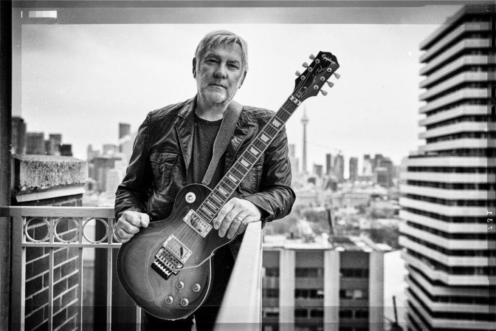 alex lifeson with his epiphone les paul standard axcess guitar