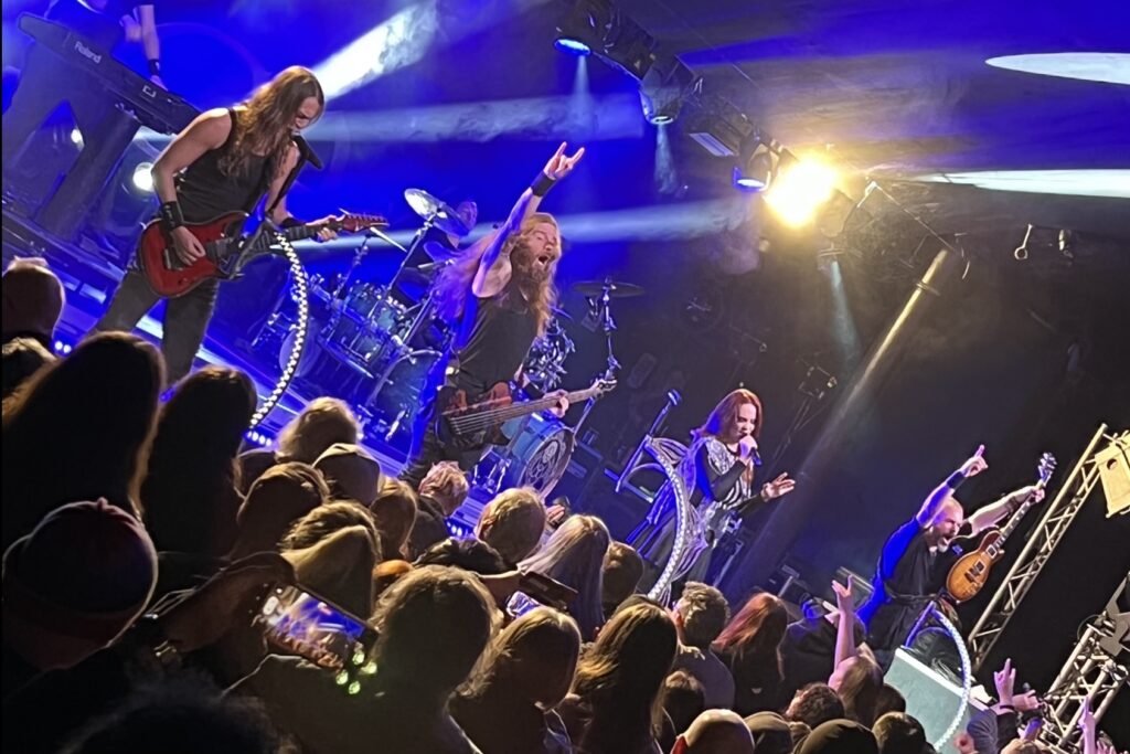 Epica on stage with blue and purple flood lighting