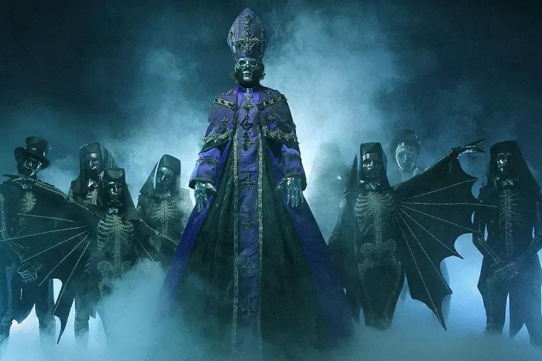 The new lin eup of Ghost stand in a haze of blue fog in the darkness